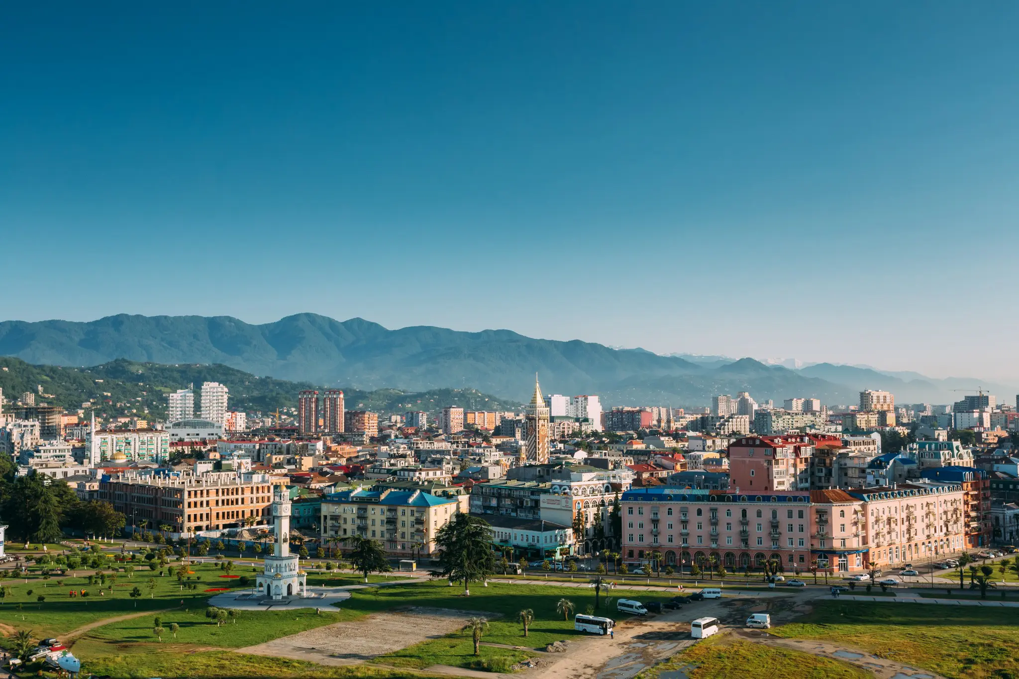 aerial view of Batumi cityscape with mountains and clear sky